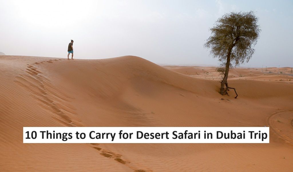 A man walking in the Dubai Desert. Things to carry for desert safari in Dubai 