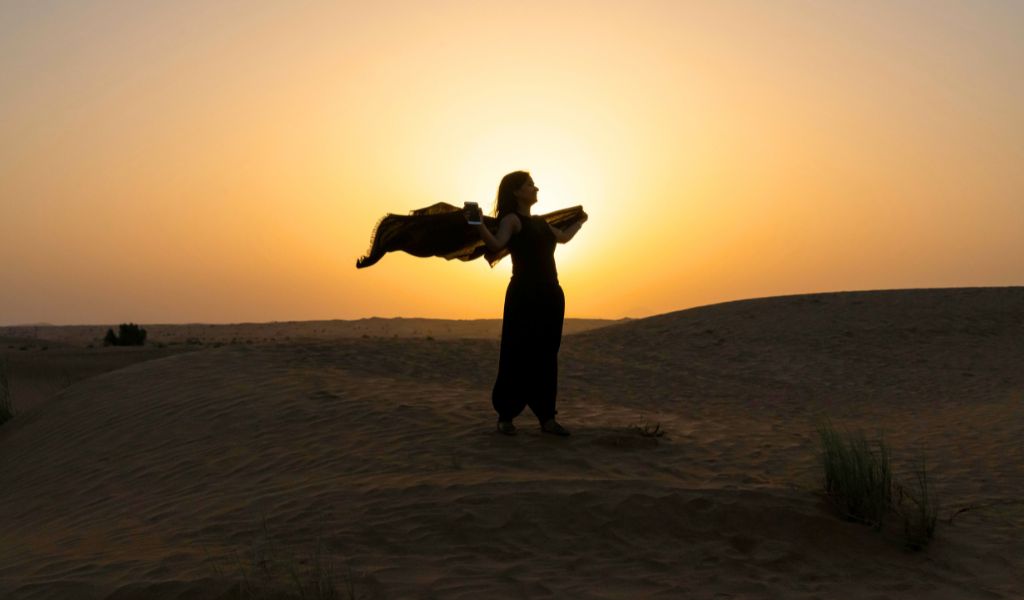 A woman tourist in Dubai Desert Safari - clothes to wear during the safari