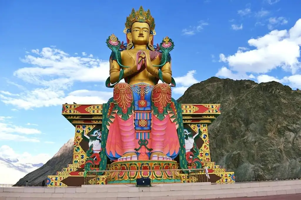 a large statue of red maitreya buddha in Red Maitreya Temple in Leh Ladakh India