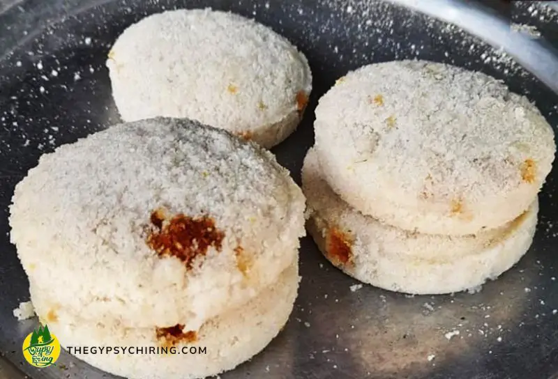 3 Keteli Pitha, Bhapa Pitha, Tekeli Pitha of Assam on a plate - Indian Street Food