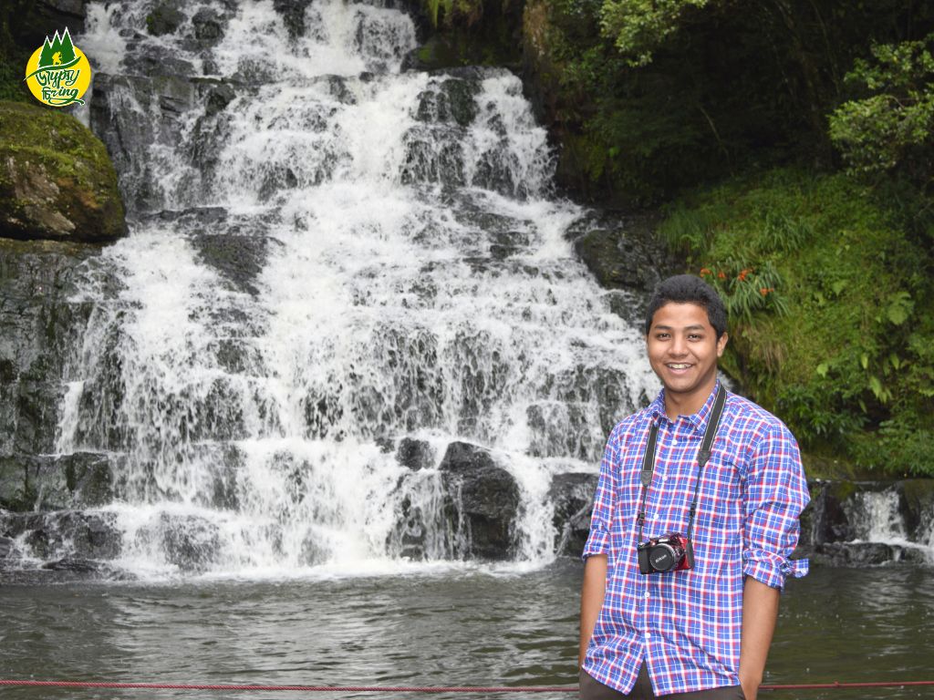 The Gypsy Chiring smiling posing in Elephant Falls in Shillong Meghalaya