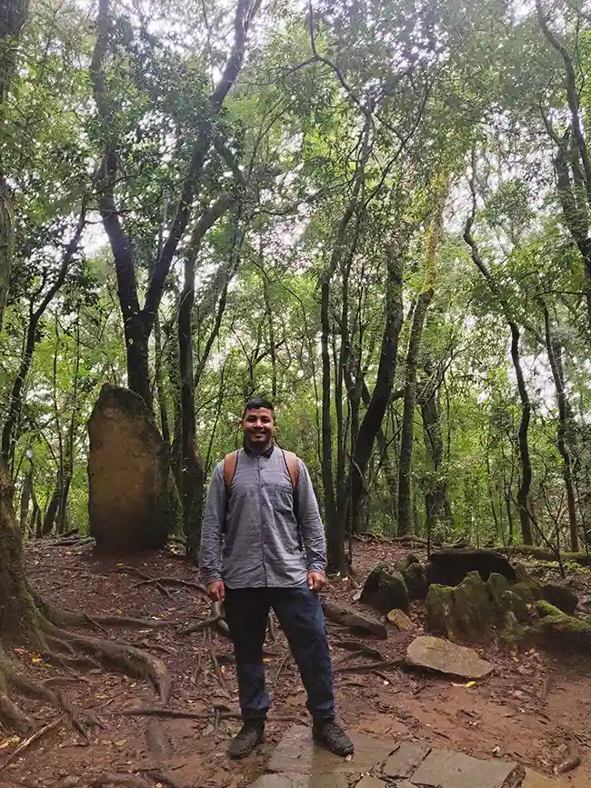 Joydeep The Gypsy Chiring smiling in the Mawphlang Sacred Forest in Meghalaya