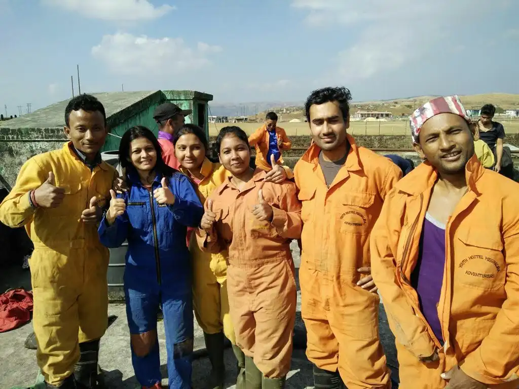 Wearing Caving Suits at the roof top of Mawmluh Caving and Dress Changing Office